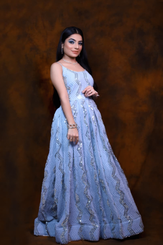 A professional portrait by Sandhya Maurya, showcasing an editorial HD makeup look with a flawless finish and subtle glam.