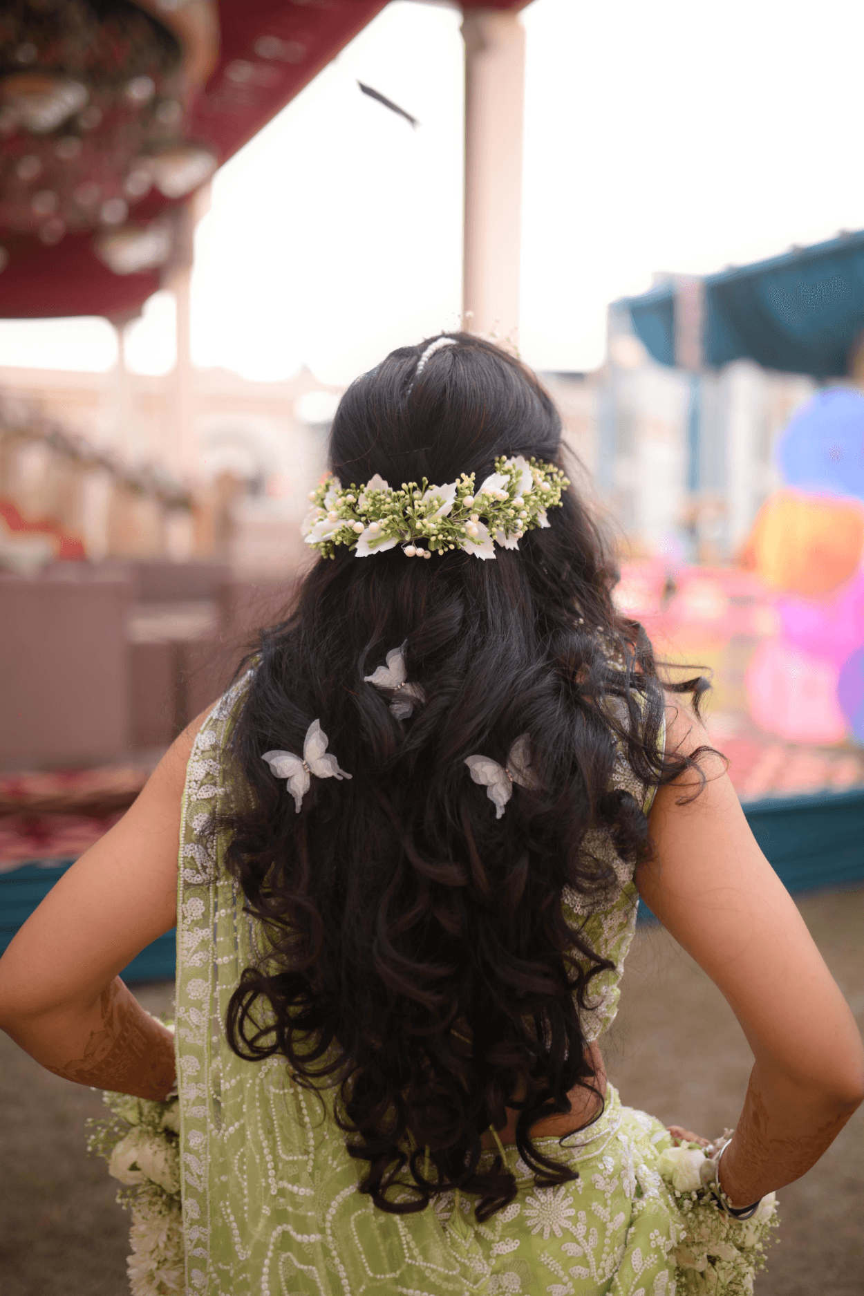 Sandhya Maurya's elegant braided hairstyle for a Haldi ceremony, adorned with fresh flowers.