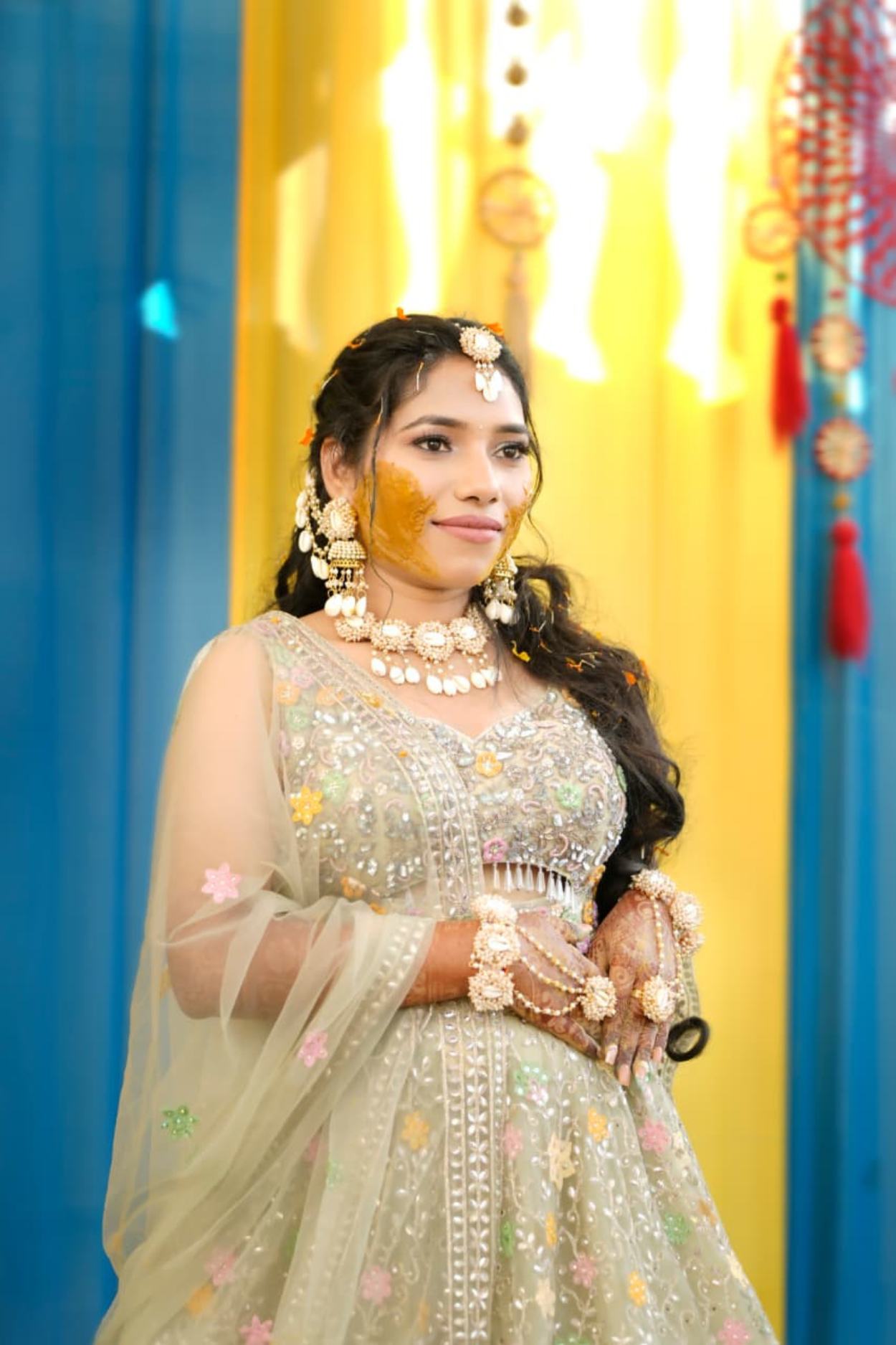 Sandhya Maurya's Ultra HD Haldi makeup, showcasing a vibrant and natural look with a radiant, golden glow.