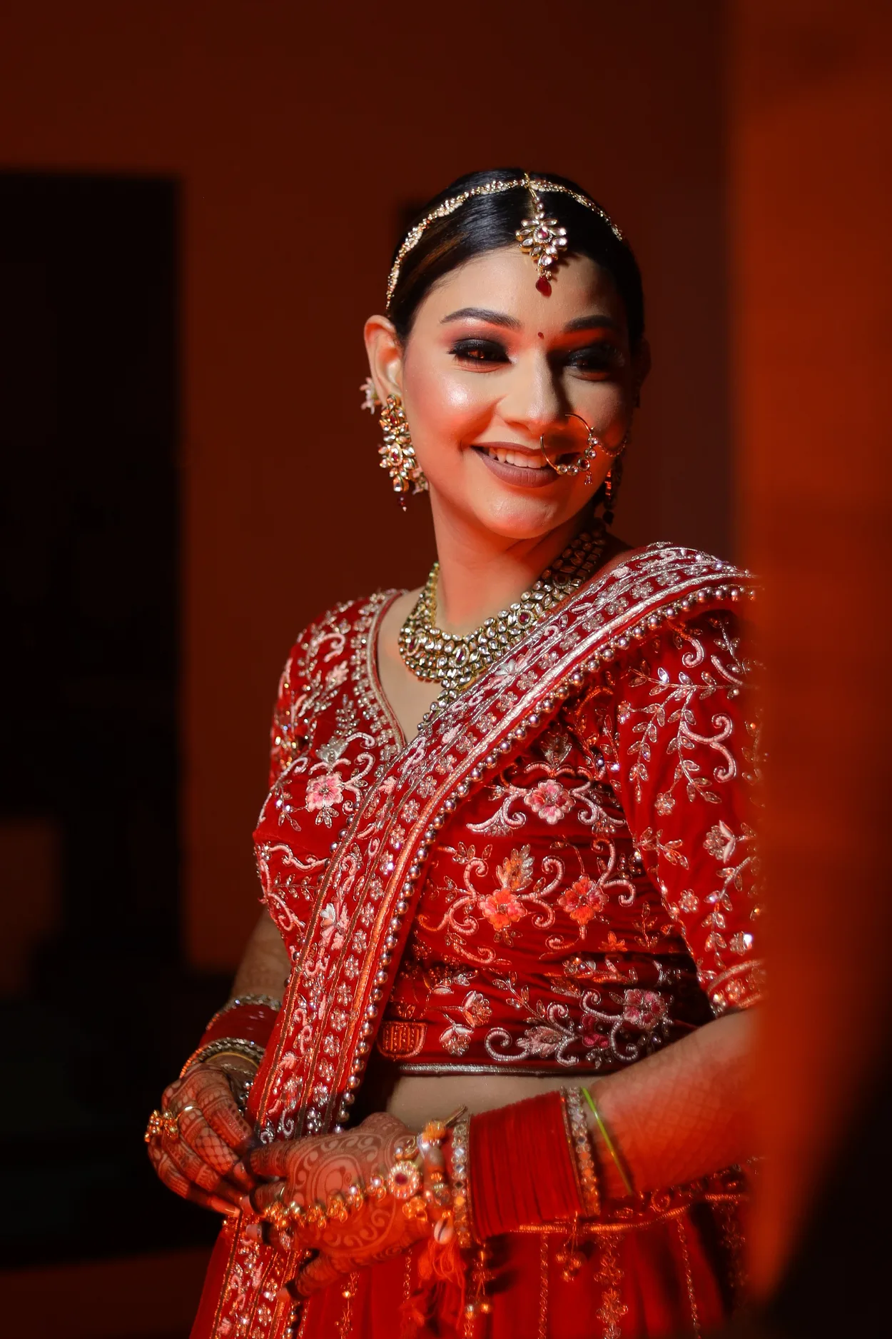 Sandhya Maurya's Ultra HD bridal makeup, showcasing a flawless complexion and a radiant, natural finish.